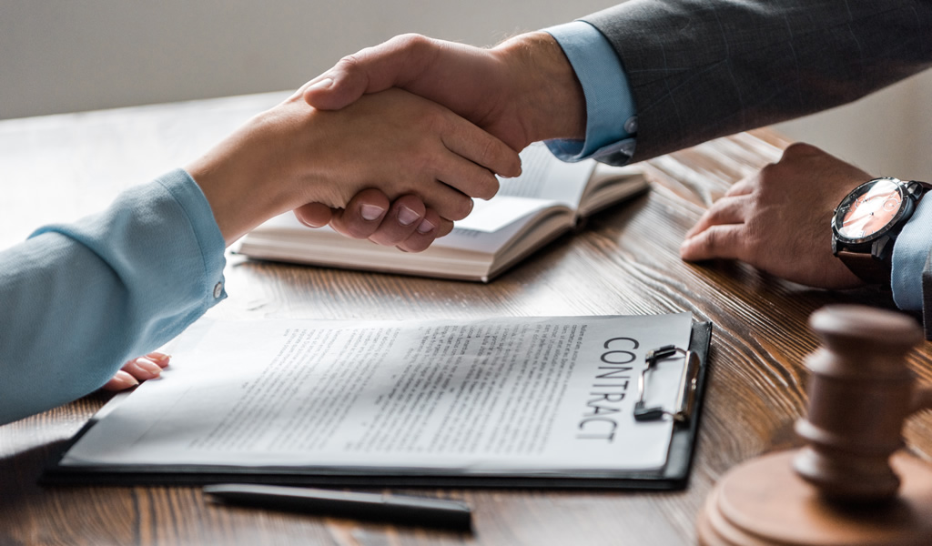 lawyer and client shaking hands