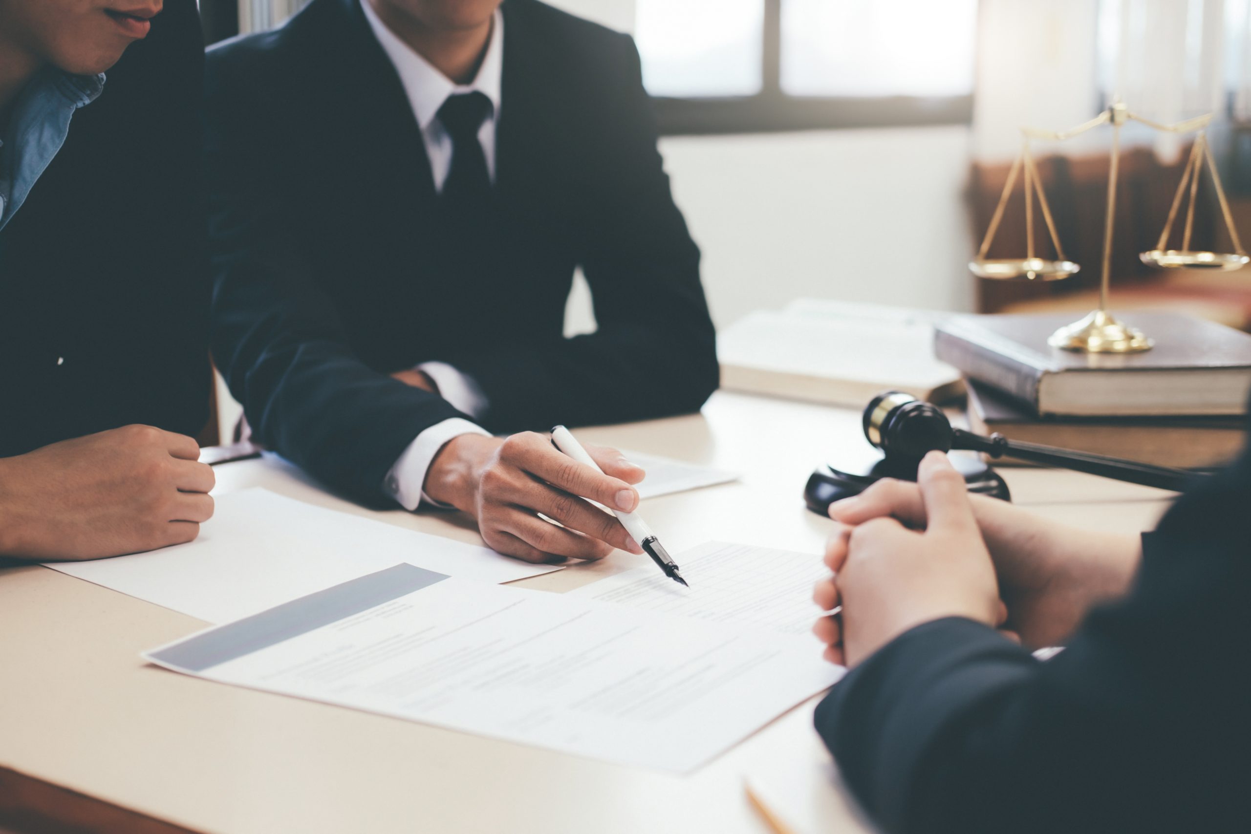 Lawyer and attorney having team meeting at law firm.